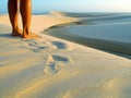 Dunes, lagoon and legs Royalty Free Stock Photo
