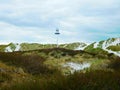 Dunes and lighthouse in Dueodde, Bornholm, Denmark Royalty Free Stock Photo