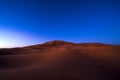 Dunes at night in Erg Chebbi near Merzouga in Morocco Royalty Free Stock Photo