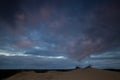 Dunes under a moody sky. Royalty Free Stock Photo