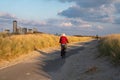 Dunes and view on Vlissingen city with sandy beach on sunset