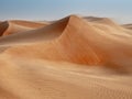 The dunes of the Wahiba Sands desert in Oman at sunset during a Royalty Free Stock Photo