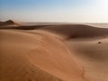 The dunes of the Wahiba Sands desert in Oman at sunset during a Royalty Free Stock Photo