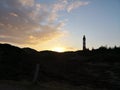 Dunescape in Amrum with lighthouse against sunset Royalty Free Stock Photo