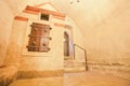 Dungeon on an old synagogue with wrought old shutters