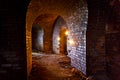 Dungeon under the old german fortress illuminated by lantern and Royalty Free Stock Photo