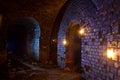 Dungeon under the old german fortress illuminated by lantern and Royalty Free Stock Photo