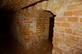 Dungeon. Underground passage, tunnel, arch laid out red brick