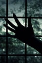 Dungeon window and hand. Escape concept Royalty Free Stock Photo
