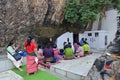 Pilgrims praying at entrance to Dungeshwari Cave, where Gautama Buddha is said to have spent 6-7 years in extreme asceticism Royalty Free Stock Photo