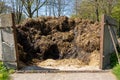 Dunghill of manure between stone walls, countryside Netherlands