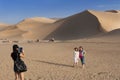 Chinese tourists at the Crescent Moon Lake near the city of Dunhuang, in the Gansu Province, China Royalty Free Stock Photo