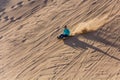DUNHUANG, CHINA - AUGUST 21, 2018: Sand sledding at Singing Sands Dune near Dunhuang, Gansu Province, Chi Royalty Free Stock Photo