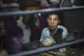 Dunhuang, China - 08 06 2016: A chinese craftsman selling souvenirs at Shazhou Market, a night market in Dunhuang