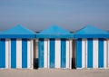 Dunkerque, France: Blue and white striped beach huts on the sand on the sea front at Malo-Les-Bains beach in Dunkirk.