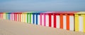 Dunkerque, France: Row of colourful striped beach huts on the sea front at Malo-Les-Bains beach in Dunkirk Royalty Free Stock Photo