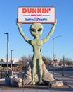 Dunkin Donuts alien holding sign