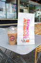 Dunkin` Donuts bag and Iced Coffe. Royalty Free Stock Photo