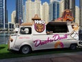 Dunkin Donuts food truck installed on Dubai Marina to satisfy tourists sweet needs. Dunkin` Donuts an American multinational coffe