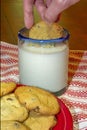 Dunking cookie in milk