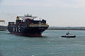 DUNKIRK/FRANCE - April 17, 2014: Tugboat towing the MSC Capella