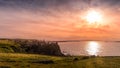 Dunluce Castle on the cliff in Bushmills, sunset Royalty Free Stock Photo