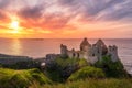 Dunluce Castle on the cliff in Bushmills, sunset Royalty Free Stock Photo