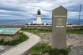 Dunnet Head lighthouse and welcome marker in Dunnet Head, Pentland Firth, Scotland