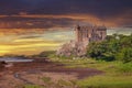 Dunvegan Castle On The Isle Of Skye, Scottish Highlands At Loch Of Dunvegan, In A Dramatic Sunset, Scotland