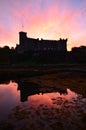 Dunvegan Castle Reflecting in the Loch at Sunrise