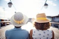 duo on a boat deck with sun hats Royalty Free Stock Photo