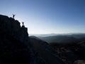 duo mountaineers engaged in exploration, adventure and successful activity in the summit mountains Royalty Free Stock Photo