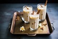 duo of small iced chai lattes on a metal tray Royalty Free Stock Photo