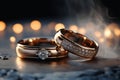A duo of sparkling engagement and wedding rings on a hazy background