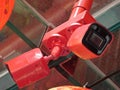 A duo vivid bright red painted surveillance cam setup