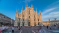 The Duomo cathedral timelapse at sunset. Front view with people walking on square