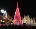 The Duomo of Milan at Christmas time, with the typical lighted tree in the middle of the square Royalty Free Stock Photo