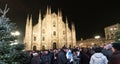 The Duomo of Milan at Christmas time, with the typical lighted tree in the middle of the square Royalty Free Stock Photo