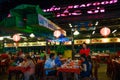 Duong Dong city, Phu Quoc, Vietnam - December 2018: night market restaurant with lanterns and eating people.