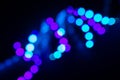 Duotone neon swirl of bokeh lights on black. Abstract background for your design Royalty Free Stock Photo