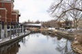 DuPage River and Naperville Riverwalk during Winter with a Bridge in Naperville Illinois Royalty Free Stock Photo