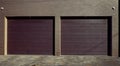 Duplex garage door. Modern, large automatic up and over. Close- up photo with selective focus Royalty Free Stock Photo