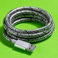 Durable Braided USB Cable on Green Background Royalty Free Stock Photo