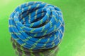 durable colored rope for climbing equipment. knot of braided cable. item for tourism and travel Royalty Free Stock Photo