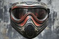 Durable paintball protective mask with paintball impact marks and colorful splatter effects Royalty Free Stock Photo