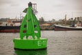 DURBAN HARBOUR, DURBAN, KWA-ZULU NATAL, SOUTH AFRICA - GREEN  BUOY MARKER IN DURBAN HARBOUR Royalty Free Stock Photo
