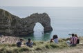 Durdle Door - the beach, the blue waters and the limestone arch.