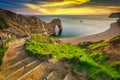 Durdle Door at the beach on the Jurassic Coast of Dorset at sunset, UK Royalty Free Stock Photo