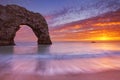 Durdle Door rock arch in Southern England at sunset