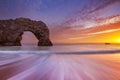 Durdle Door rock arch in Southern England at sunset Royalty Free Stock Photo